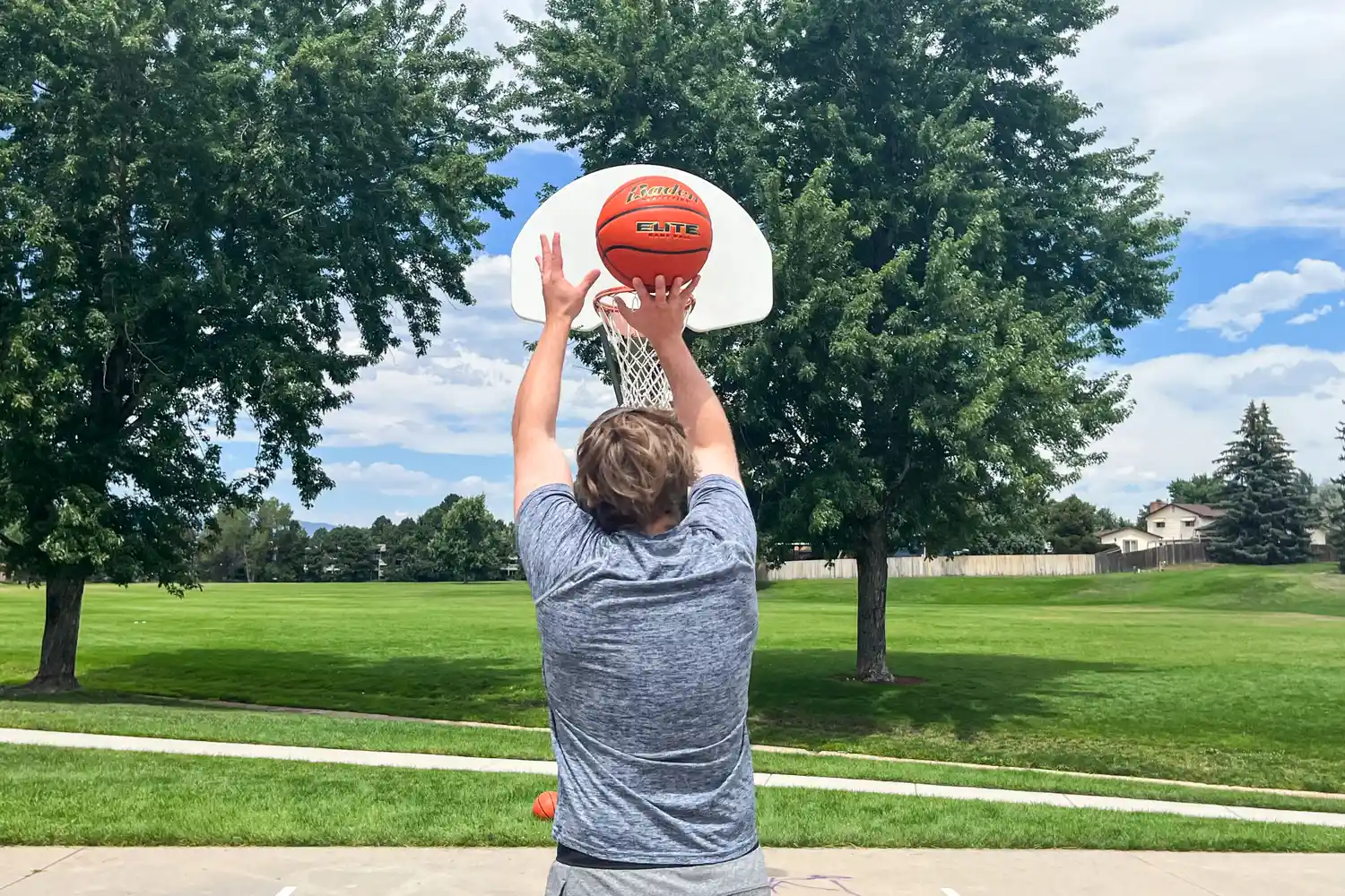 A person shoots the Baden Elite Game Basketball