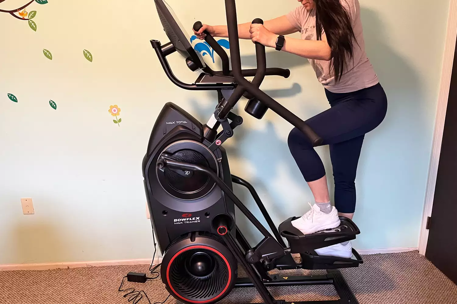 A person exercising on the BowFlex Max Total 16