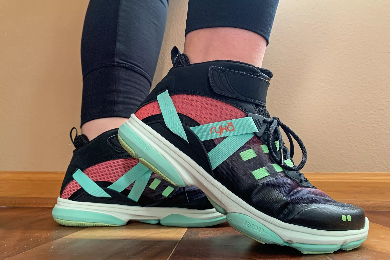 A side view of a pair of Ryka Devotion XT Mid Top Training Shoes